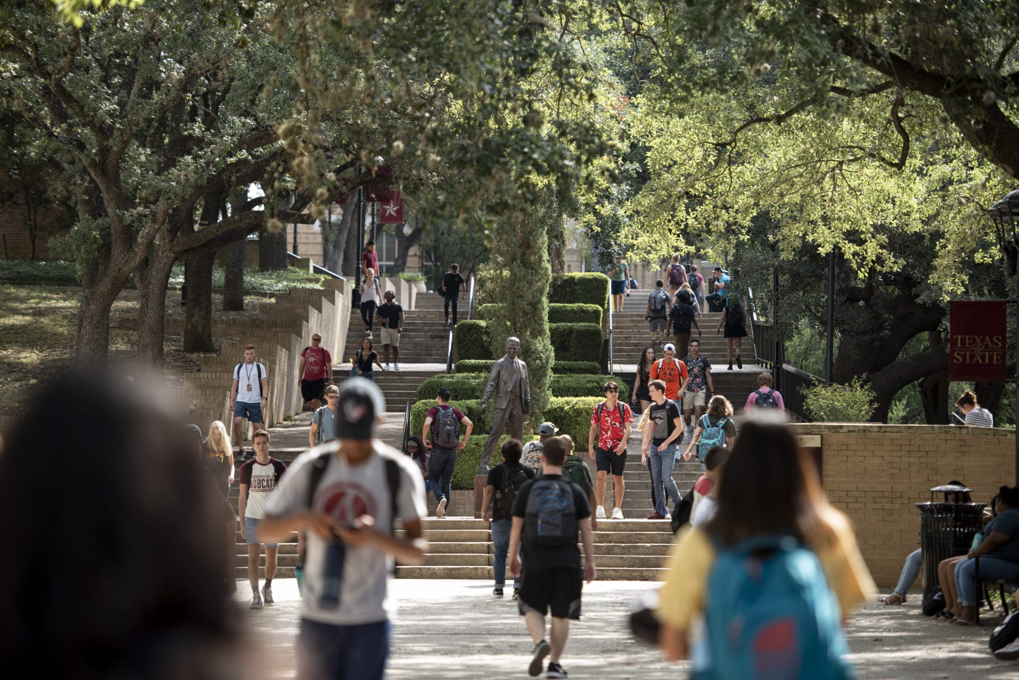 Campus walkway with students